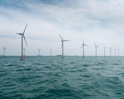 Offshore wind farm with beautiful sea water clean energy background